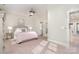 Cozy bedroom with a plush bed, bedside lamps, and neutral décor creating a relaxing atmosphere at 1103 N Sharon Amity Rd, Charlotte, NC 28211