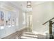 Inviting foyer with hardwood floors, white trim, and plenty of natural light at 1103 N Sharon Amity Rd, Charlotte, NC 28211