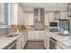 Spacious kitchen with stainless steel appliances, granite countertops, and custom white cabinetry at 1103 N Sharon Amity Rd, Charlotte, NC 28211