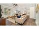 Spacious living room with hardwood floors, neutral decor, and plenty of natural light at 1103 N Sharon Amity Rd, Charlotte, NC 28211