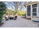 Outdoor patio featuring a fire pit with comfortable seating, outdoor furniture, and a screened porch at 1103 N Sharon Amity Rd, Charlotte, NC 28211