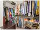 Spacious walk-in closet with shelving, hanging racks, and ample storage space for clothes and shoes at 1103 N Sharon Amity Rd, Charlotte, NC 28211