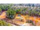 Aerial view of the house and surrounding wooded lot at 118 River Ridge Ln, Hickory, NC 28601