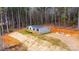 Gray manufactured home on wooded lot with deck at 118 River Ridge Ln, Hickory, NC 28601