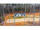 House nestled in a wooded area, seen from an aerial perspective at 118 River Ridge Ln, Hickory, NC 28601