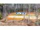 Aerial view of the home, highlighting its setting in the woods at 118 River Ridge Ln, Hickory, NC 28601