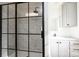 Modern bathroom with a frameless glass shower and marble-look tile at 118 River Ridge Ln, Hickory, NC 28601