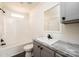 Clean bathroom with a bathtub, toilet and vanity with gray cabinets at 118 River Ridge Ln, Hickory, NC 28601