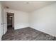 Bright bedroom with gray flooring and access to a full bathroom at 118 River Ridge Ln, Hickory, NC 28601