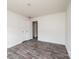 Well-lit bedroom featuring gray flooring and double door closet at 118 River Ridge Ln, Hickory, NC 28601