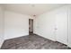 Spacious bedroom with gray wood-look flooring and a double door closet at 118 River Ridge Ln, Hickory, NC 28601