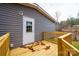 Wooden deck with railing and white door leading to the house at 118 River Ridge Ln, Hickory, NC 28601