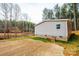 Side view of a gray manufactured home on a partially cleared lot at 118 River Ridge Ln, Hickory, NC 28601