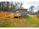 Manufactured home with a wooden deck and steps leading to the side entrance at 118 River Ridge Ln, Hickory, NC 28601