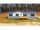 Gray and white mobile home with wood deck and landscaping at 118 River Ridge Ln, Hickory, NC 28601