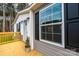 Close up of the home's exterior, highlighting the gray siding and black shutters at 118 River Ridge Ln, Hickory, NC 28601