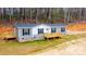 New manufactured home with gray siding and wooden deck at 118 River Ridge Ln, Hickory, NC 28601