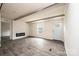 Bright living room features wood-look floors, fireplace, and a window with deck view at 118 River Ridge Ln, Hickory, NC 28601