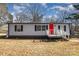 Gray mobile home with red door and white railing at 125 Garden Ln, Salisbury, NC 28146