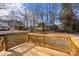 New deck overlooks a fenced backyard with mature trees at 126 Terrace Dr, Bessemer City, NC 28016