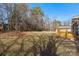 Large backyard with a wooden deck and mature trees at 126 Terrace Dr, Bessemer City, NC 28016