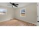 Spacious bedroom with hardwood floors, large windows, and ceiling fan at 126 Terrace Dr, Bessemer City, NC 28016
