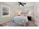 Cozy bedroom with a queen-size bed, ceiling fan and stylish decor at 126 Terrace Dr, Bessemer City, NC 28016