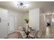Small dining area with glass table and four chairs at 126 Terrace Dr, Bessemer City, NC 28016