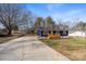 Newly renovated home with blue siding, wood deck, and driveway at 126 Terrace Dr, Bessemer City, NC 28016