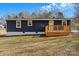 Newly renovated home with a modern exterior and deck at 126 Terrace Dr, Bessemer City, NC 28016