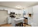 Updated kitchen with white cabinets and an island at 126 Terrace Dr, Bessemer City, NC 28016