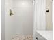 Clean shower with white tile and a hexagon patterned shower floor at 126 Terrace Dr, Bessemer City, NC 28016