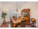 Formal dining room with a large wooden table and hutch at 14226 Carlton Woods Ln, Charlotte, NC 28278