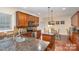 Spacious kitchen with granite countertops and stainless steel appliances at 14226 Carlton Woods Ln, Charlotte, NC 28278
