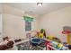 Playful ' room with toys, a play mat, and a small basketball hoop at 14226 Carlton Woods Ln, Charlotte, NC 28278