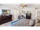 This spacious main bedroom has dark wood dressers and a relaxing, neutral color palette at 1724 Falls Cove Rd, Newton, NC 28658