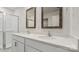 Modern bathroom featuring a double sink vanity, walk-in shower, and two decorative mirrors at 1730 Falls Cove Rd, Newton, NC 28658