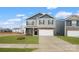 Charming two-story home features a two-car garage, stone accents, and well-manicured lawn at 1730 Falls Cove Rd, Newton, NC 28658