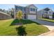 Charming two-story home with a stone facade, two-car garage, and a well-manicured front lawn at 1742 Falls Cove Rd, Newton, NC 28658