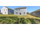 A two-story home with a well-maintained green lawn in the backyard at 1758 Falls Cove Rd, Newton, NC 28658