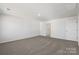 A spacious bedroom with carpeted flooring, a ceiling light and white walls at 1758 Falls Cove Rd, Newton, NC 28658