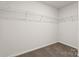 A bedroom walk-in closet that features carpeted floor and wire shelving at 1758 Falls Cove Rd, Newton, NC 28658