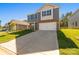 Charming home featuring gray siding, stone accents, a two-car garage, and long driveway at 1758 Falls Cove Rd, Newton, NC 28658