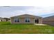 Spacious backyard with a concrete patio area and ample green space perfect for outdoor entertaining at 1766 Falls Cove Rd, Newton, NC 28658