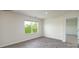 Bright bedroom with a large window and wood-look flooring at 1766 Falls Cove Rd, Newton, NC 28658