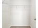 Walk-in closet equipped with shelving for optimal storage and organization at 1766 Falls Cove Rd, Newton, NC 28658