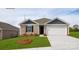 Charming single Gathering home featuring a two car garage and a well manicured lawn at 1766 Falls Cove Rd, Newton, NC 28658