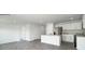 Open kitchen with granite counters, stainless appliances, and island at 1766 Falls Cove Rd, Newton, NC 28658