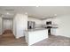 Modern kitchen with white cabinets, stainless appliances, and island seating at 1766 Falls Cove Rd, Newton, NC 28658