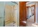 Bathroom with shower, tub and hallway view at 200 11Th St, Spencer, NC 28159